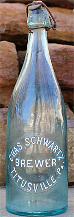 CHARLES SCHWARTZ BREWER EMBOSSED BEER BOTTLE