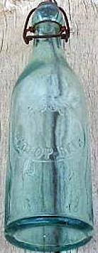 RUSS REDTOP BEER EMBOSSED BEER BOTTLE