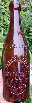 RYAN'S LAGER EMBOSSED BEER BOTTLE