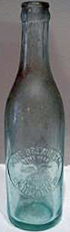 HOME BREWING COMPANY EMBOSSED BEER BOTTLE