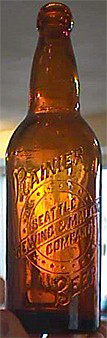 RAINIER BEER SEATTLE BREWING & MALTING COMPANY EMBOSSED BEER BOTTLE