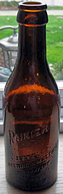 RAINIER BEER SEATTLE BREWING & MALTING COMPANY EMBOSSED BEER BOTTLE