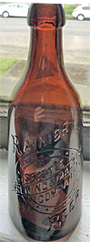 RAINIER BEER SEATTLE BREWING & MALTING COMPANY EMBOSSED BEER BOTTLE