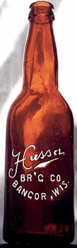 HUSSA BREWING COMPANY EMBOSSED BEER BOTTLE