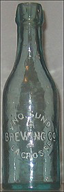 JOHN GUND BREWING COMPANY EMBOSSED BEER BOTTLE