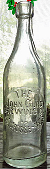 JOHN GUND BREWING COMPANY EMBOSSED BEER BOTTLE