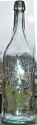 JOHN GUND BREWING COMPANY EMBOSSED BEER BOTTLE