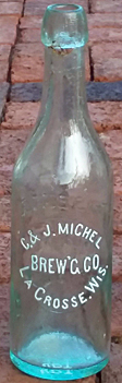 C. & J. MICHEL BREWING COMPANY EMBOSSED BEER BOTTLE