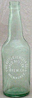 FRED MILLER BREWING COMPANY EMBOSSED BEER BOTTLE