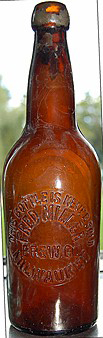 FRED MILLER BREWING COMPANY EMBOSSED BEER BOTTLE