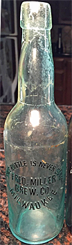 FRED MILLER BREWING COMPANY EMBOSSED BEER BOTTLE