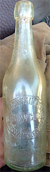 FRED MILLER BREWING COMPANY EMBOSSED BEER BOTTLE