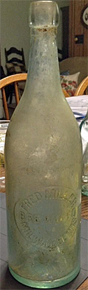 FRED MILLER BREWING COMPANY EMBOSSED BEER BOTTLE