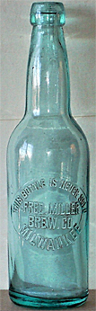 FRED MILLER BREWING COMPANY EMBOSSED BEER BOTTLE