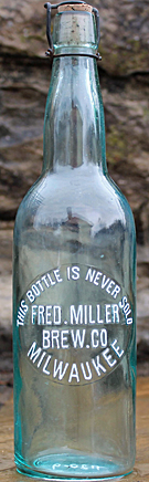 FRED MILLER BREWING COMPANY EMBOSSED BEER BOTTLE