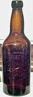 J. OBERMANN BREWING COMPANY EMBOSSED BEER BOTTLE