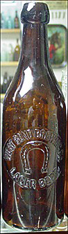 WEST BEND BREWING COMPANY LAGER BEER EMBOSSED BEER BOTTLE